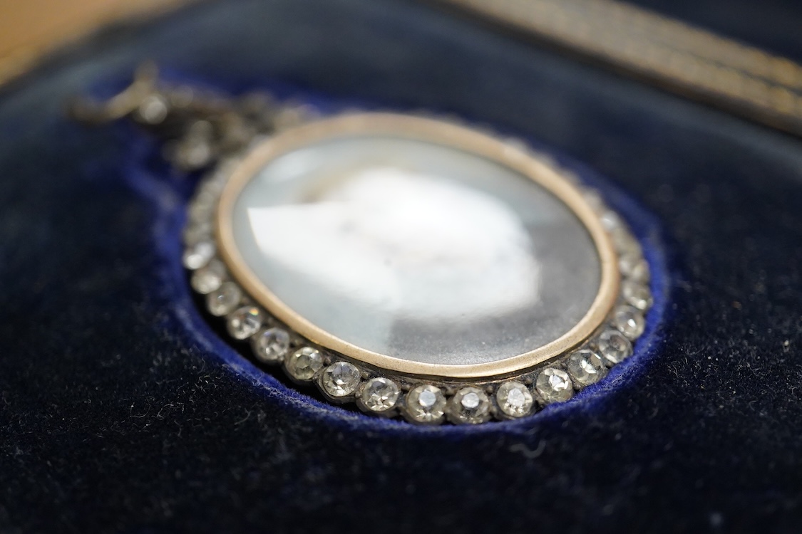 Early 20th century school, Portrait miniature of a gentleman, oval watercolour on ivory, housed in a silver and paste pendant frame, with gilt tooled leather case, 3.5 x 2.5cm CITES Submission reference 5A81E2GB